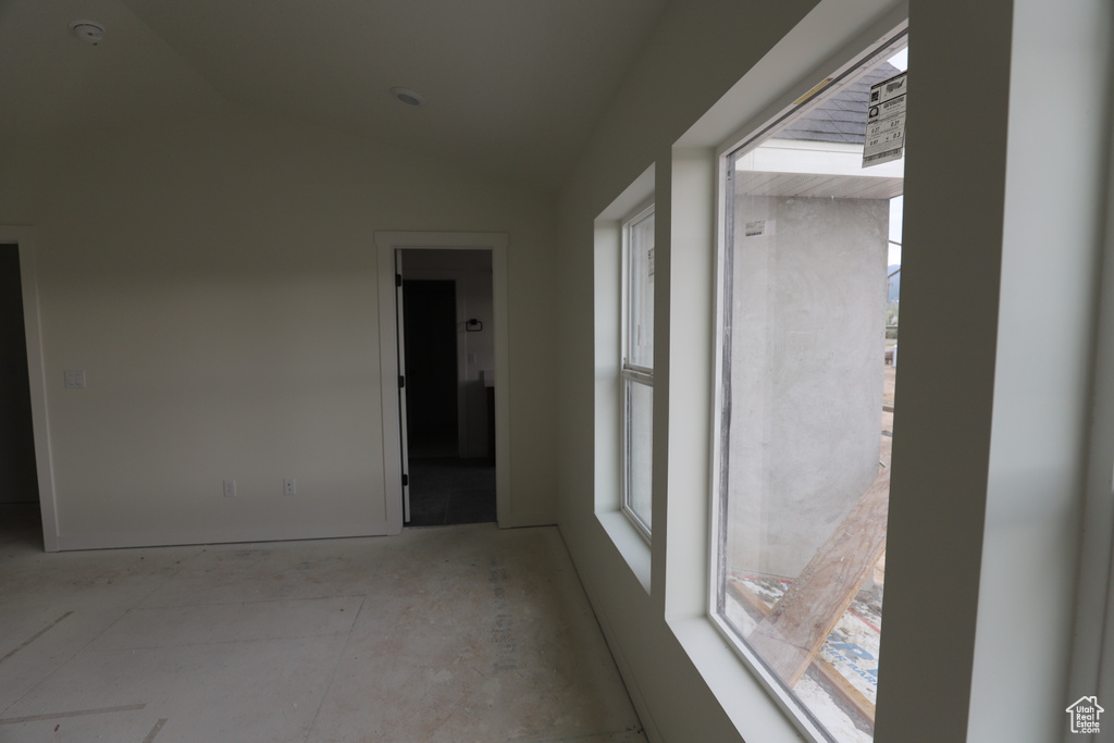 Spare room with vaulted ceiling