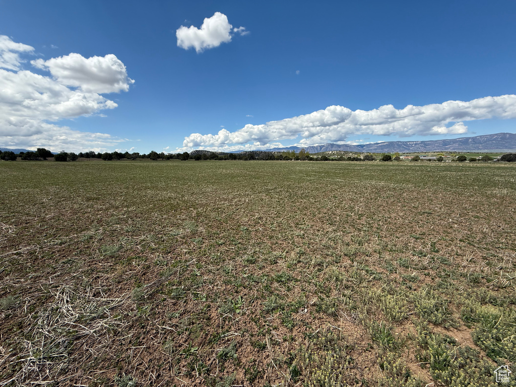 View of mountain backdrop with rural landscape