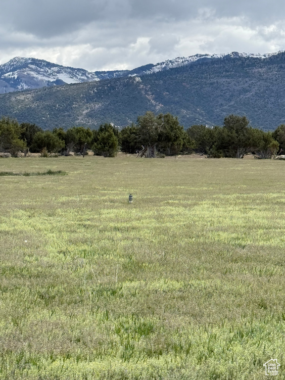 View of mountain backdrop with rural landscape