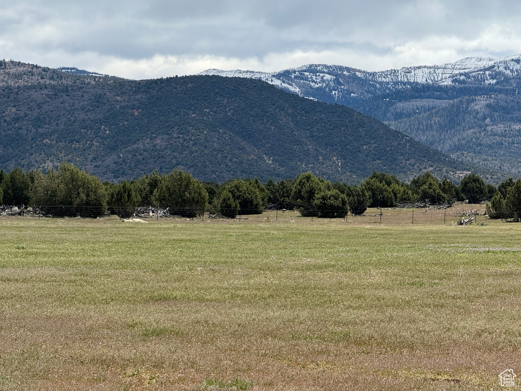 View of mountain background featuring rural landscape