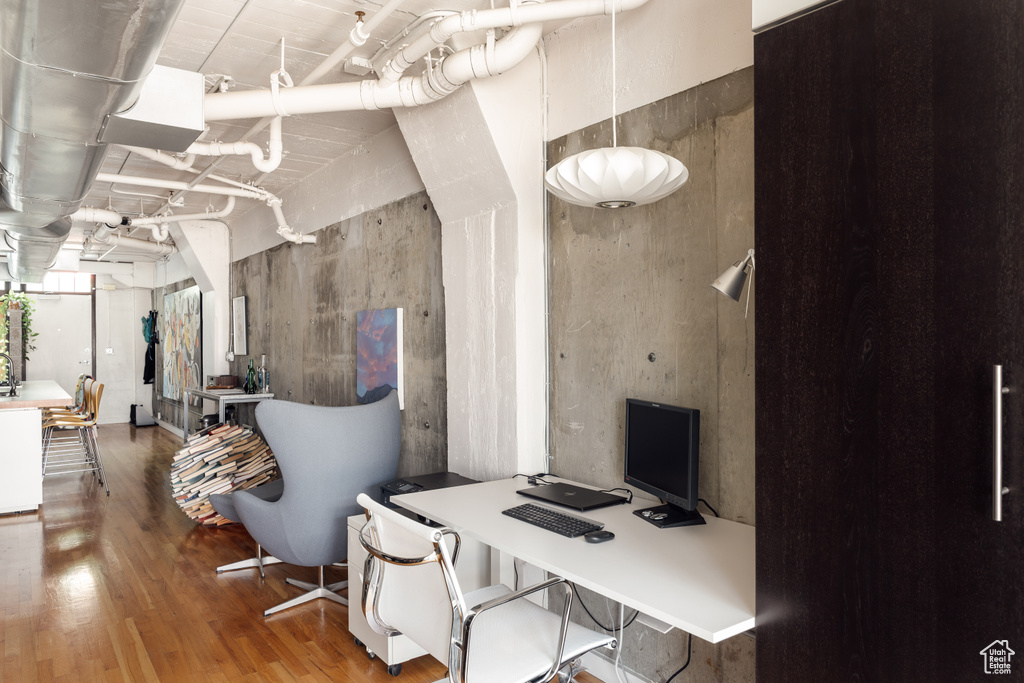 Office area featuring wood finished floors