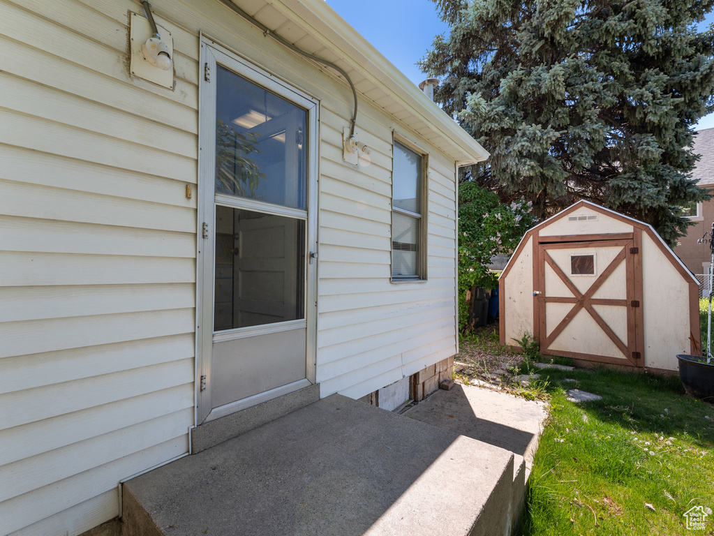 Doorway to property with a yard