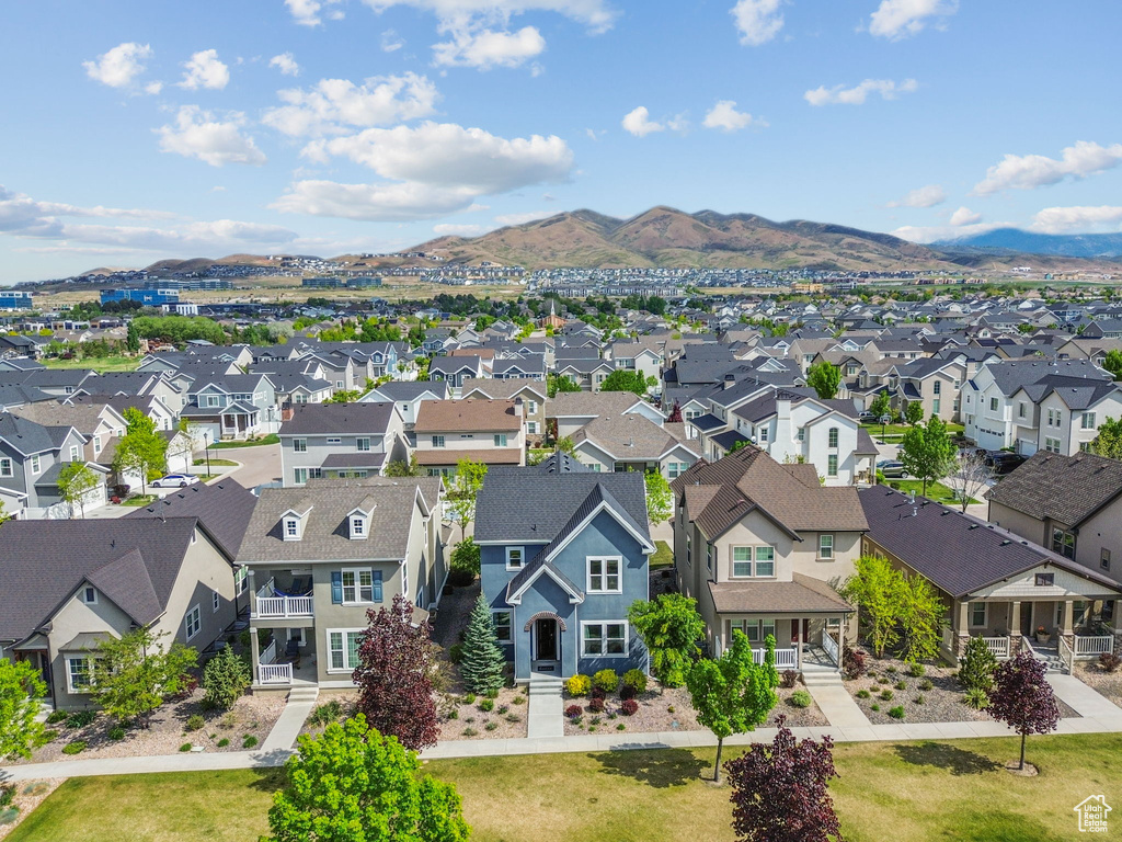 Aerial perspective of suburban area with a mountainous background