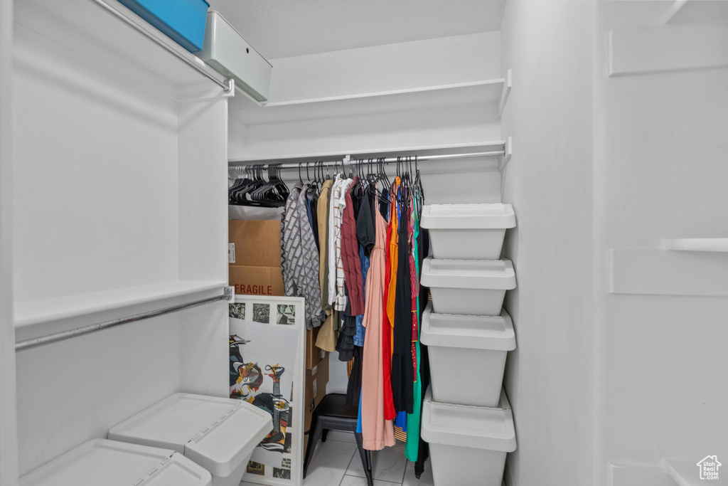 Spacious closet featuring tile patterned floors