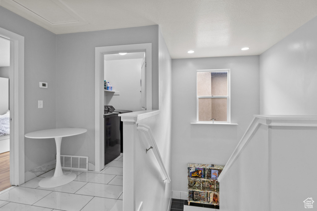 Corridor featuring baseboards and recessed lighting