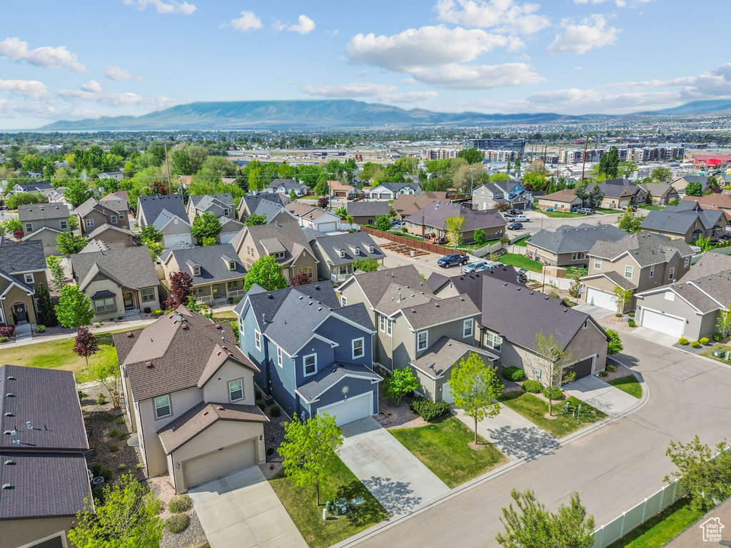 Aerial perspective of suburban area with a mountainous background