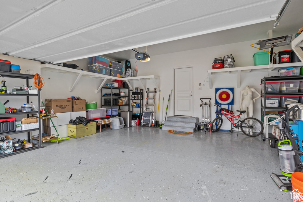 Garage featuring a garage door opener