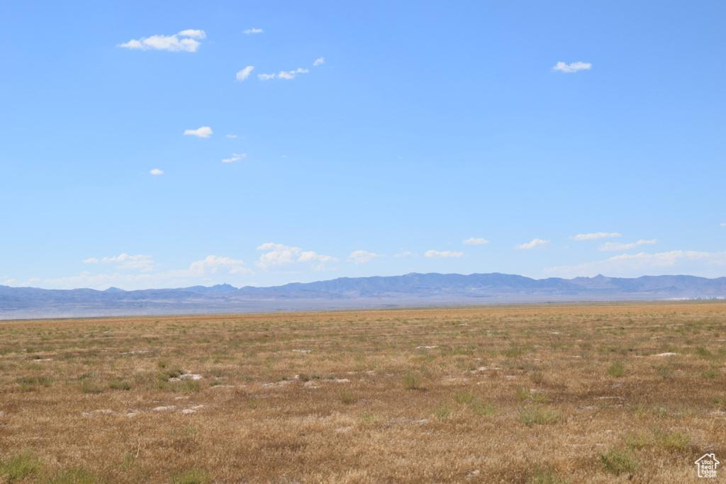 View of mountain backdrop with rural landscape