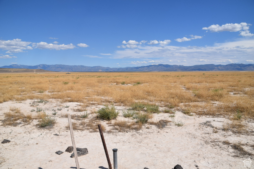 View of mountain backdrop featuring rural landscape
