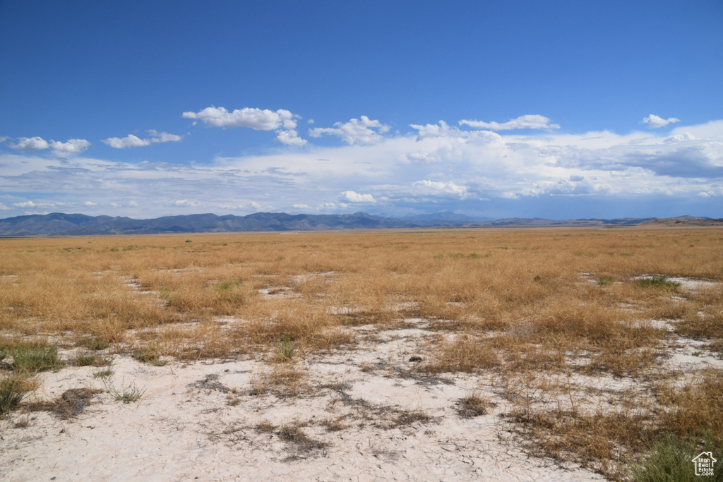 View of mountain backdrop featuring rural landscape