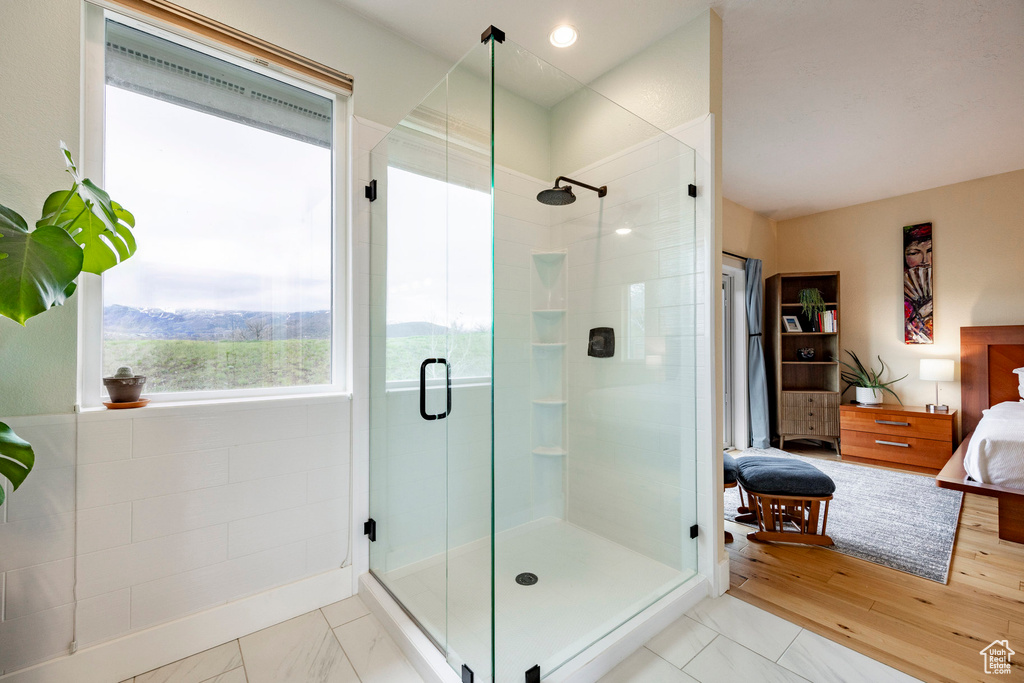 Ensuite bathroom featuring a stall shower
