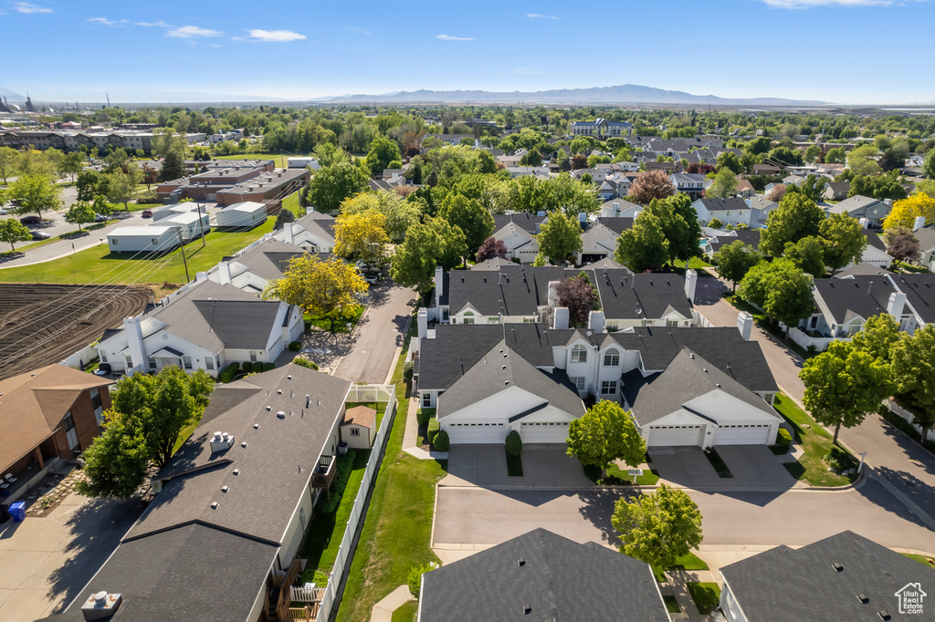 Aerial perspective of suburban area featuring a mountainous background
