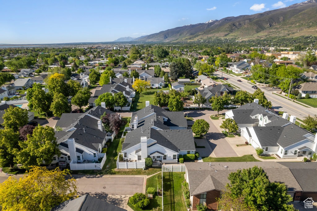 Aerial perspective of suburban area with a mountain backdrop