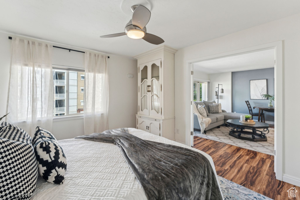 Bedroom with wood finished floors and a ceiling fan
