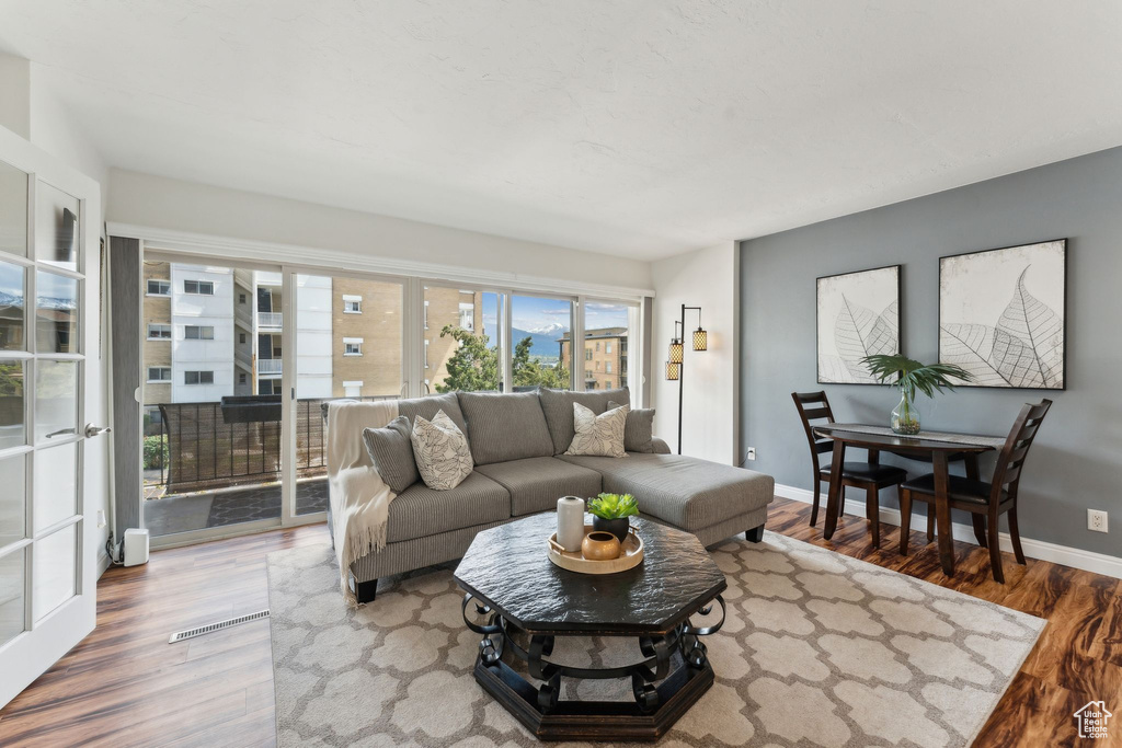 Living room with wood finished floors and baseboards