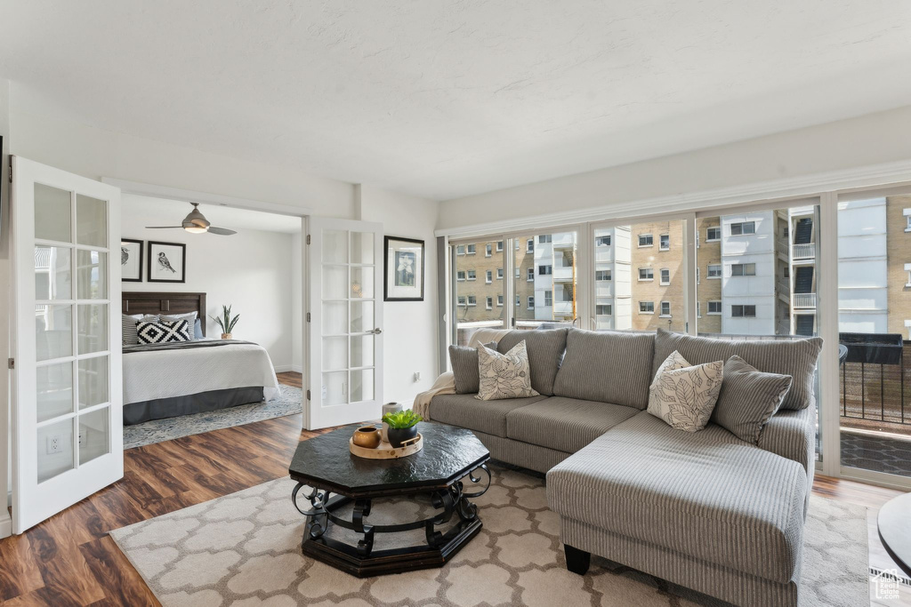 Living area featuring french doors, wood finished floors, and plenty of natural light