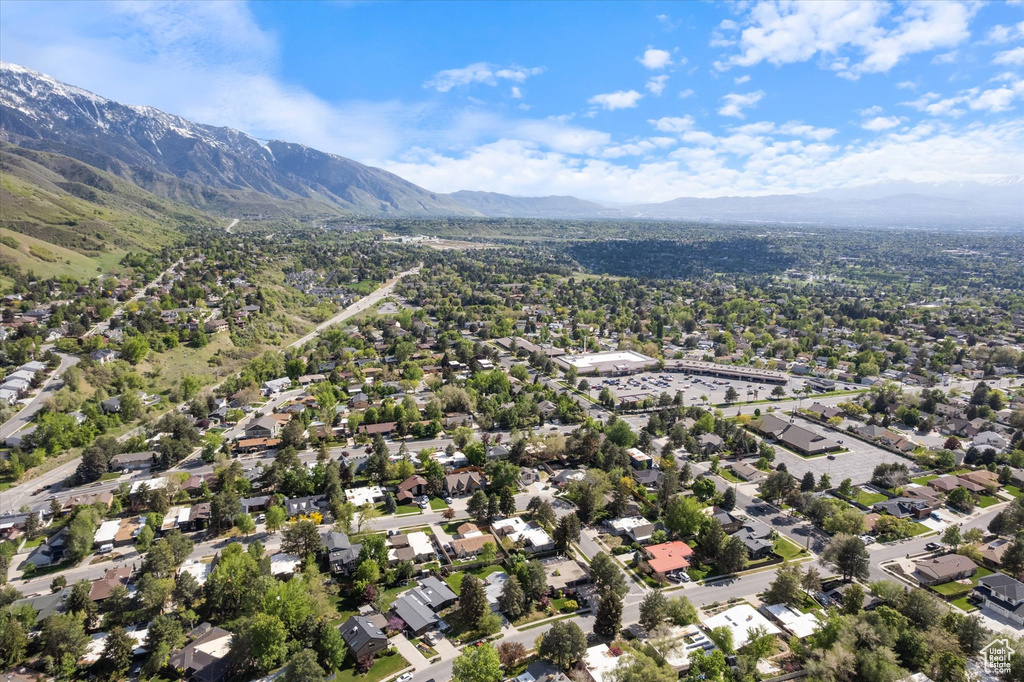 Aerial perspective of suburban area with a mountainous background