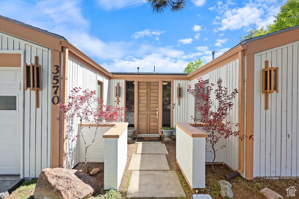 Doorway to property with board and batten siding