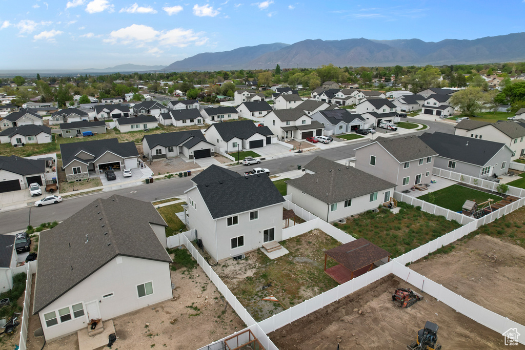 Aerial perspective of suburban area featuring a mountain backdrop