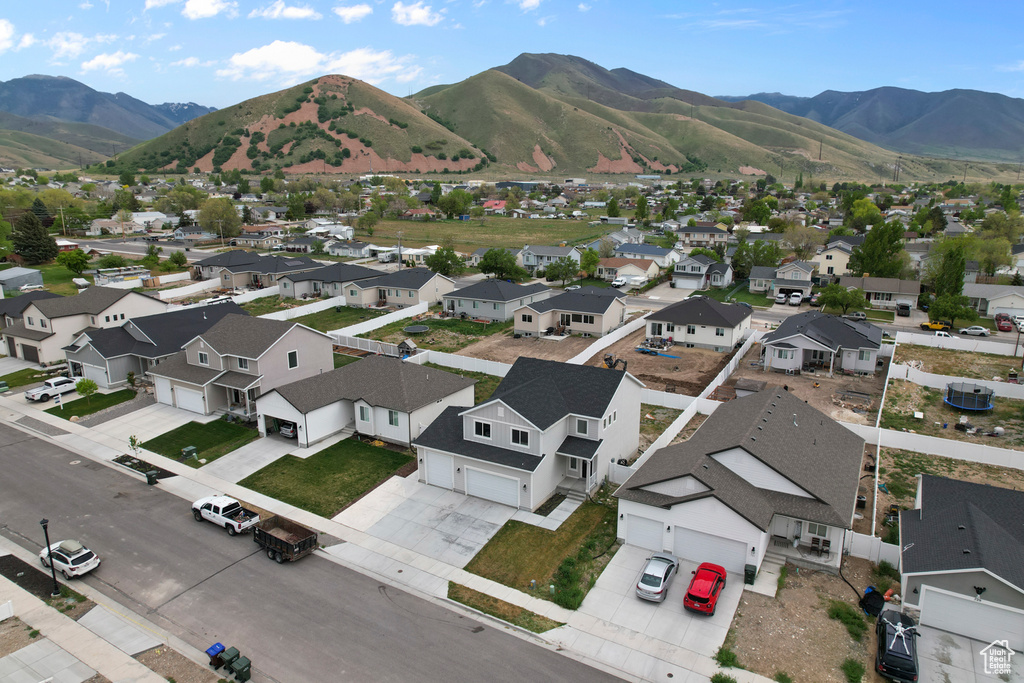 Aerial perspective of suburban area featuring a mountain backdrop
