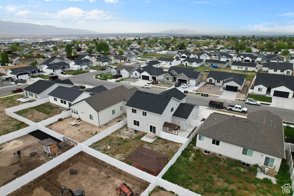 Aerial perspective of suburban area with a mountain backdrop