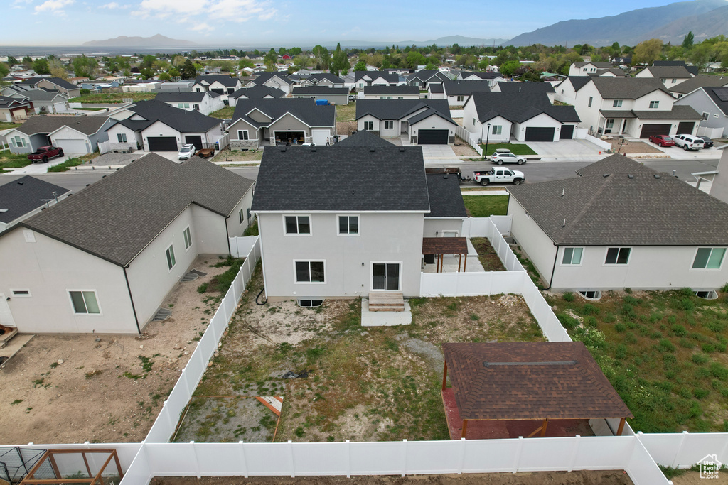 Aerial view of residential area with a mountainous background