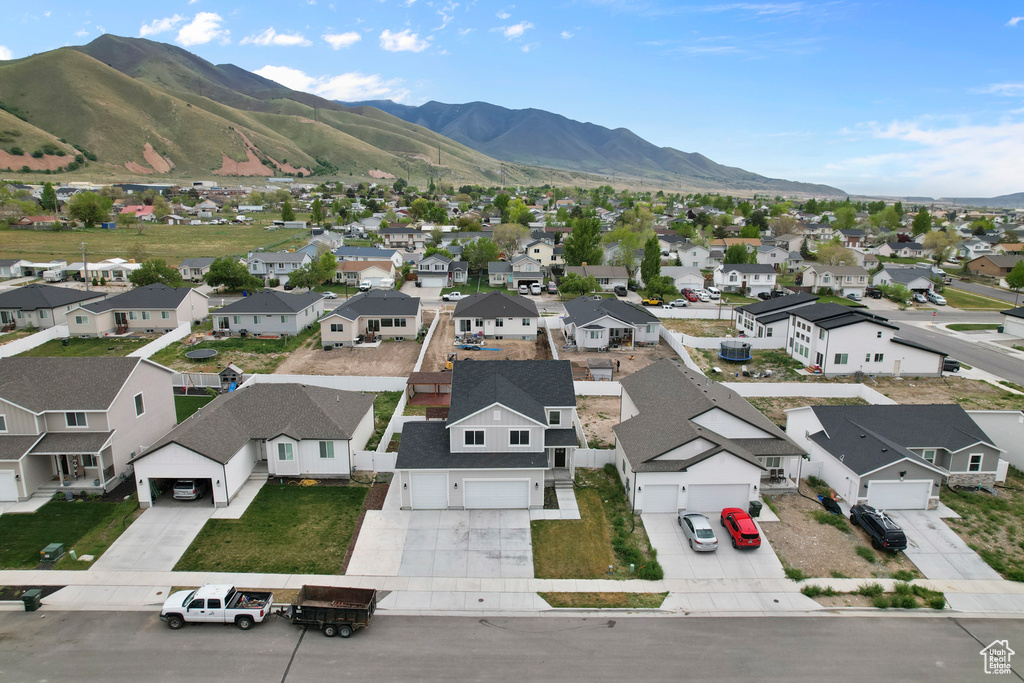 Aerial perspective of suburban area featuring a mountain backdrop