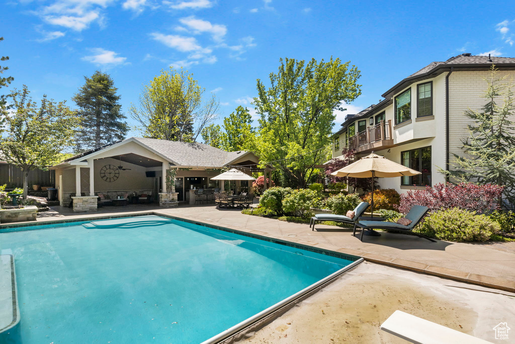 Swimming pool with a patio