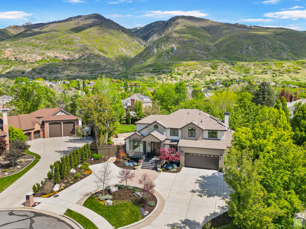 View from above of property with a mountain backdrop
