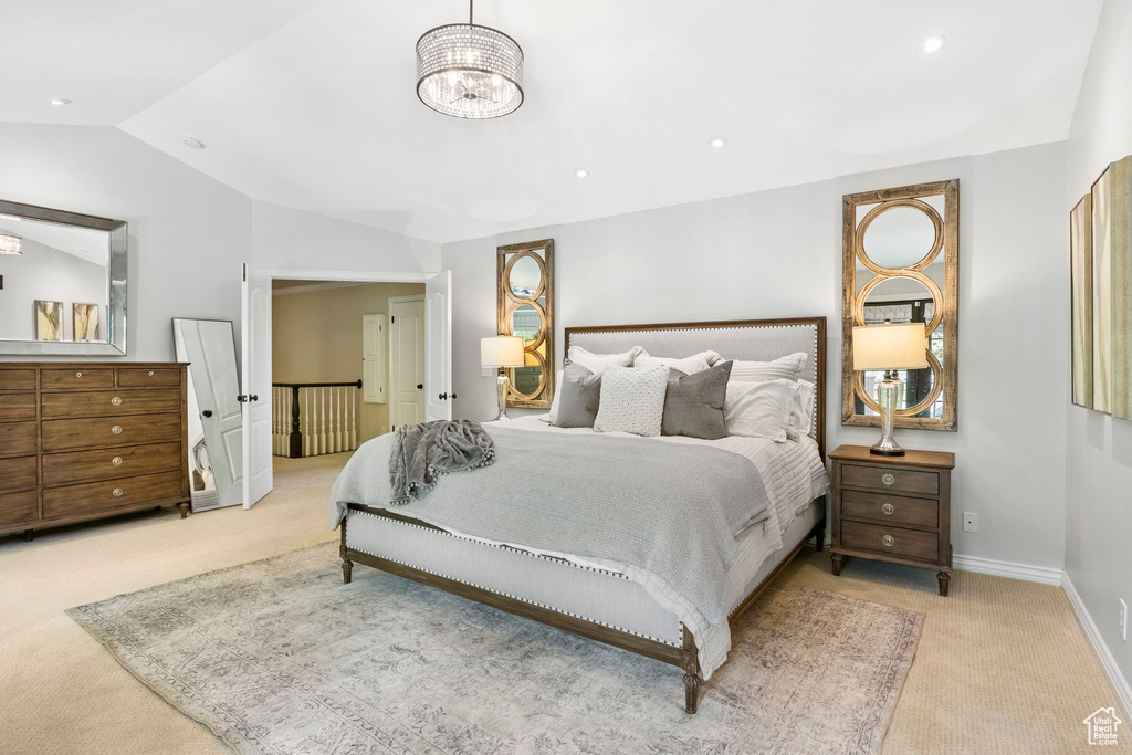 Carpeted bedroom featuring lofted ceiling, baseboards, a chandelier, and recessed lighting