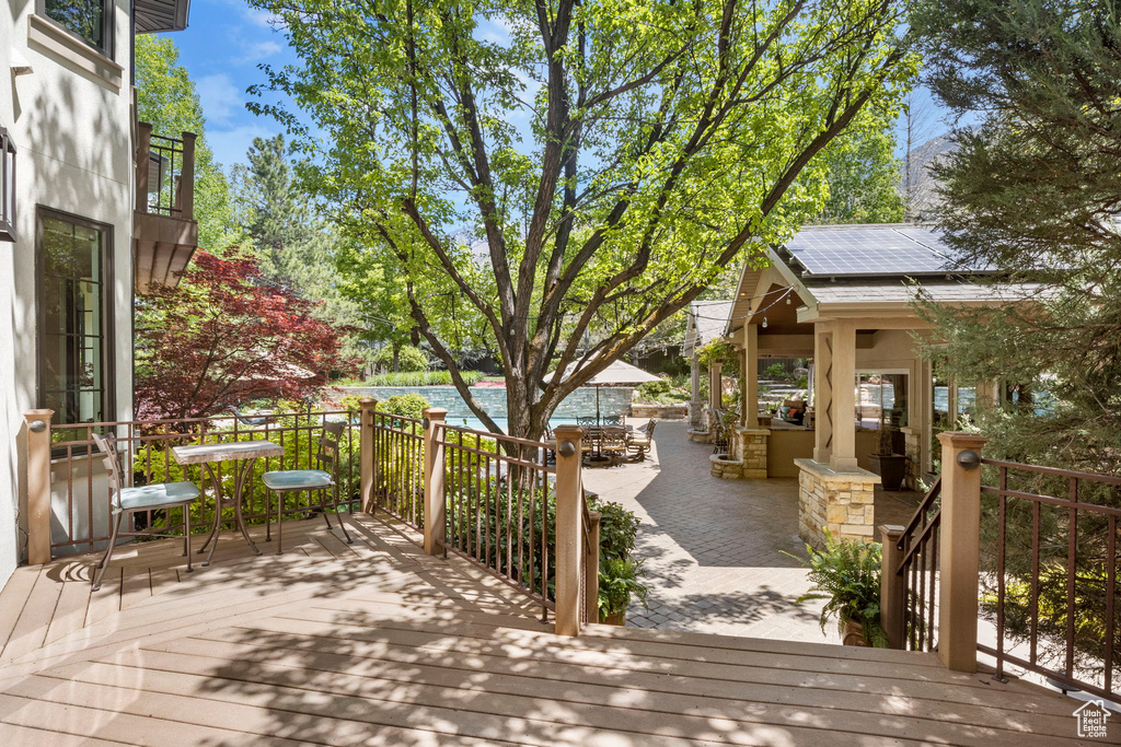Deck with a patio and a swimming pool