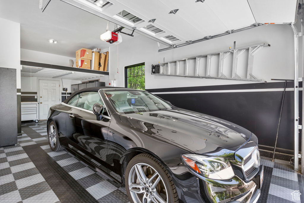 Garage featuring a garage door opener