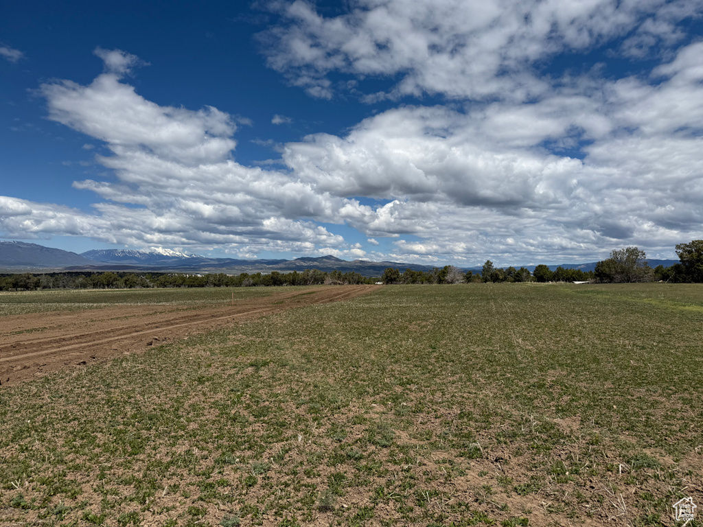 View of mountain backdrop featuring rural landscape