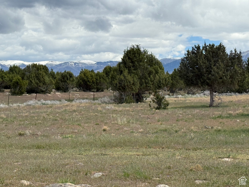 View of mountain backdrop with rural landscape