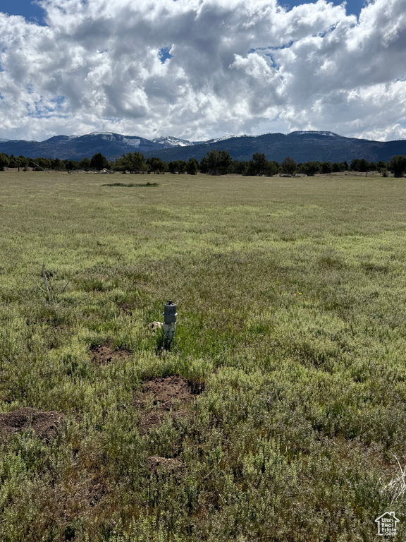 View of mountain background featuring rural landscape
