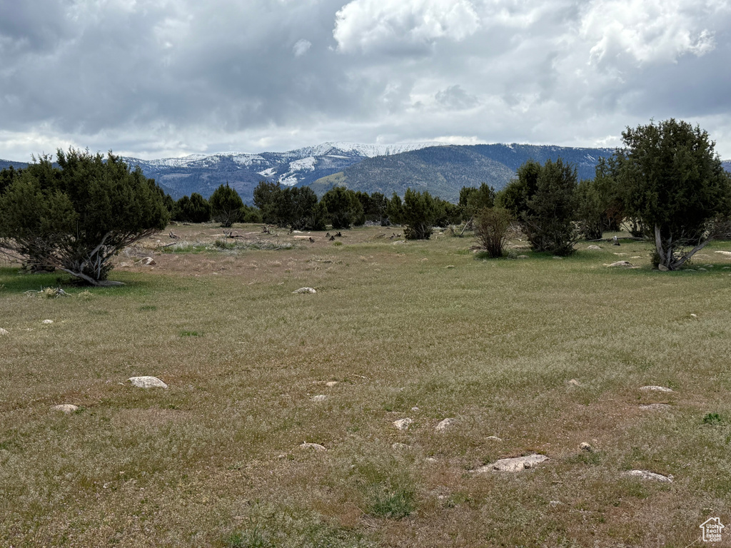 View of mountain backdrop with rural landscape