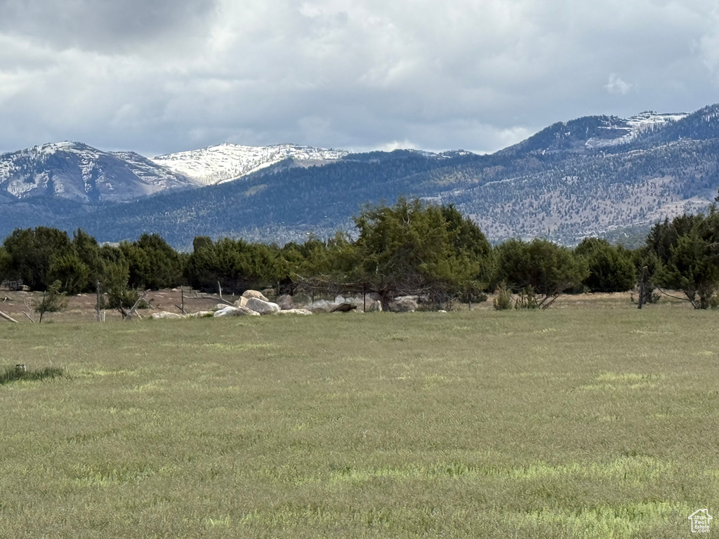 View of mountain backdrop featuring rural landscape