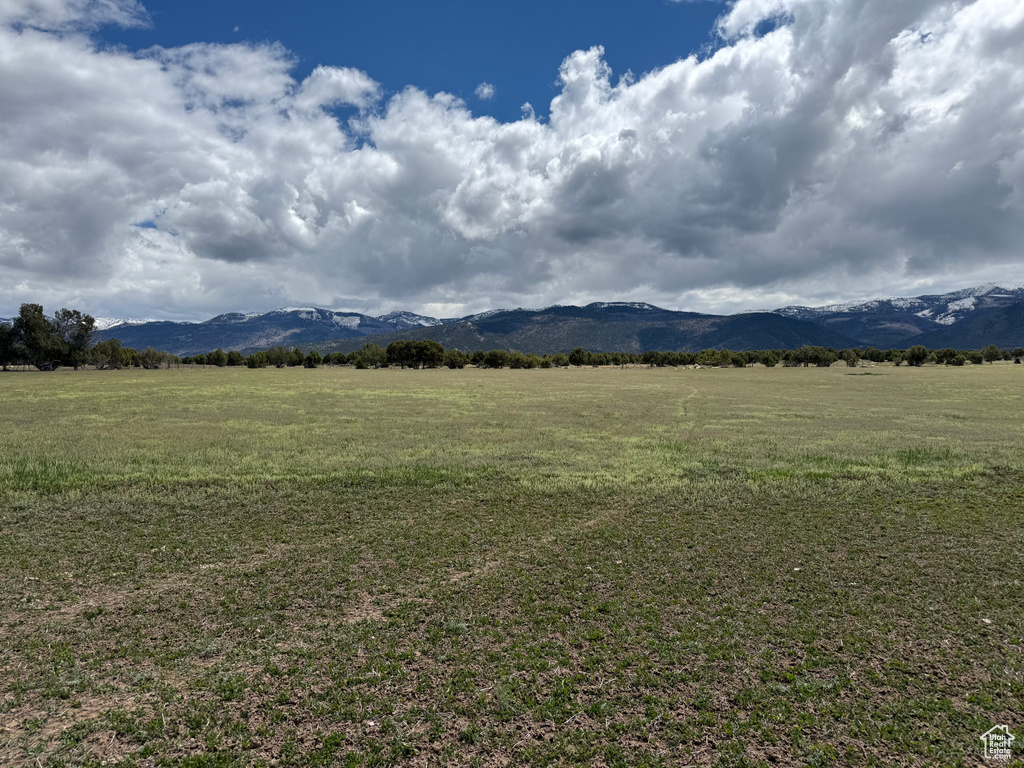 View of mountain background featuring rural landscape