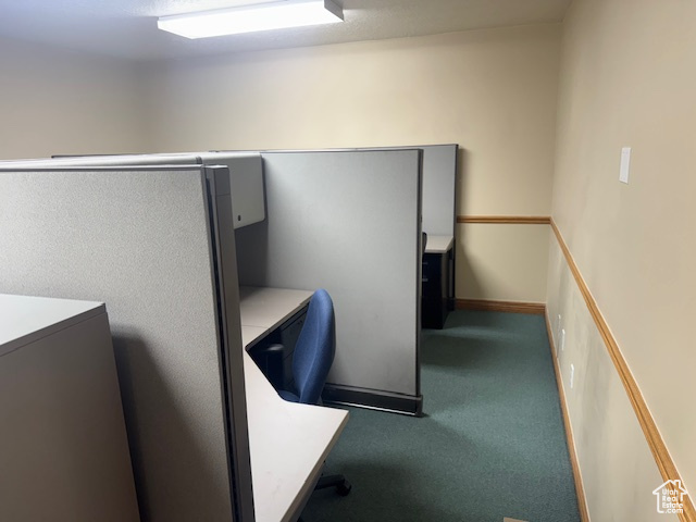 Unfurnished office featuring carpet flooring