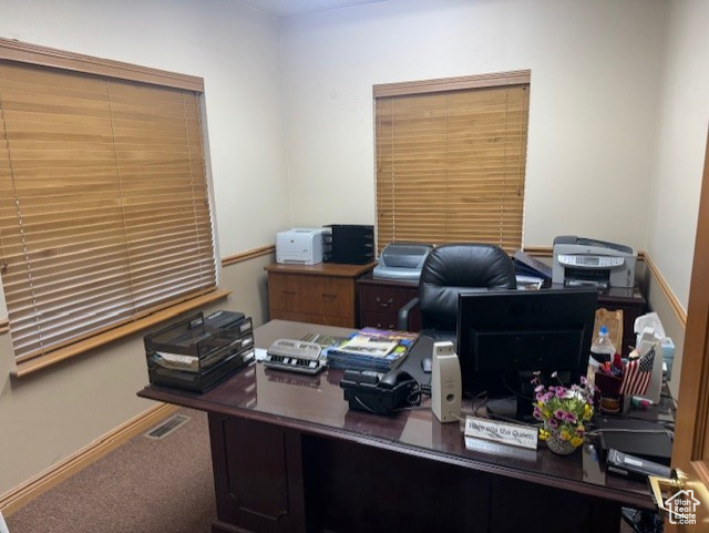 View of carpeted home office