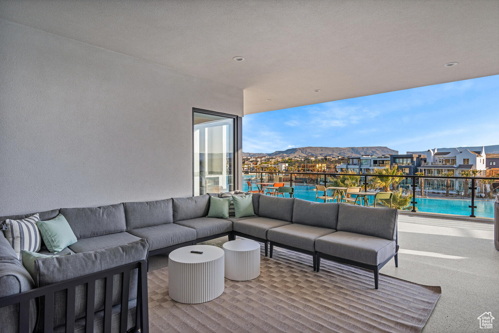 View of patio featuring an outdoor hangout area and a community pool