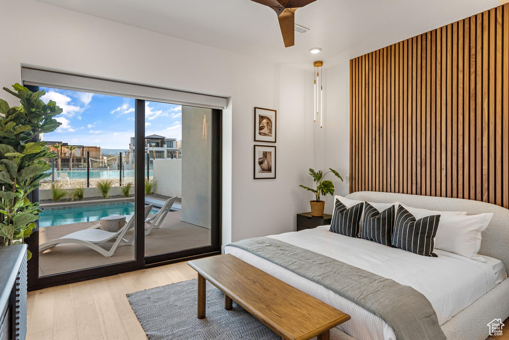 Bedroom featuring access to outside, wood finished floors, ceiling fan, and recessed lighting