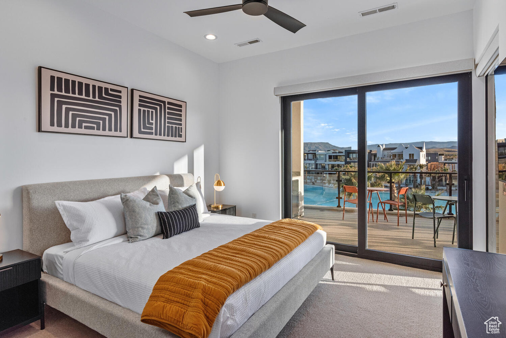 Carpeted bedroom with access to exterior, a ceiling fan, and recessed lighting
