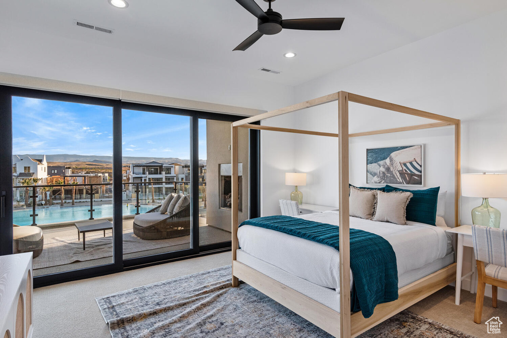 Bedroom with access to exterior, carpet flooring, recessed lighting, and ceiling fan