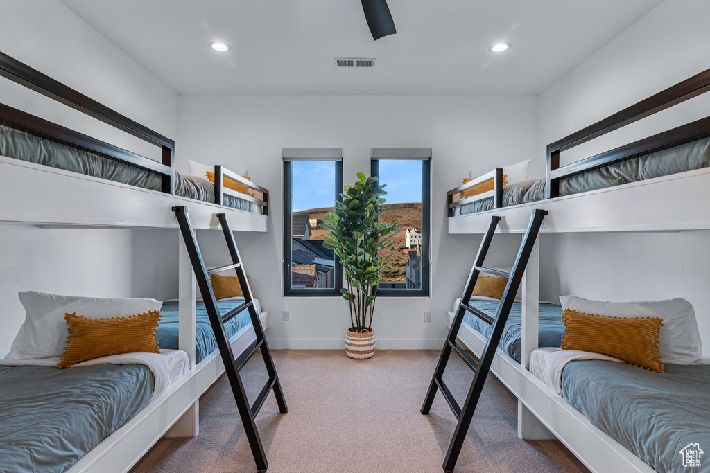 Carpeted bedroom with recessed lighting, baseboards, and a ceiling fan