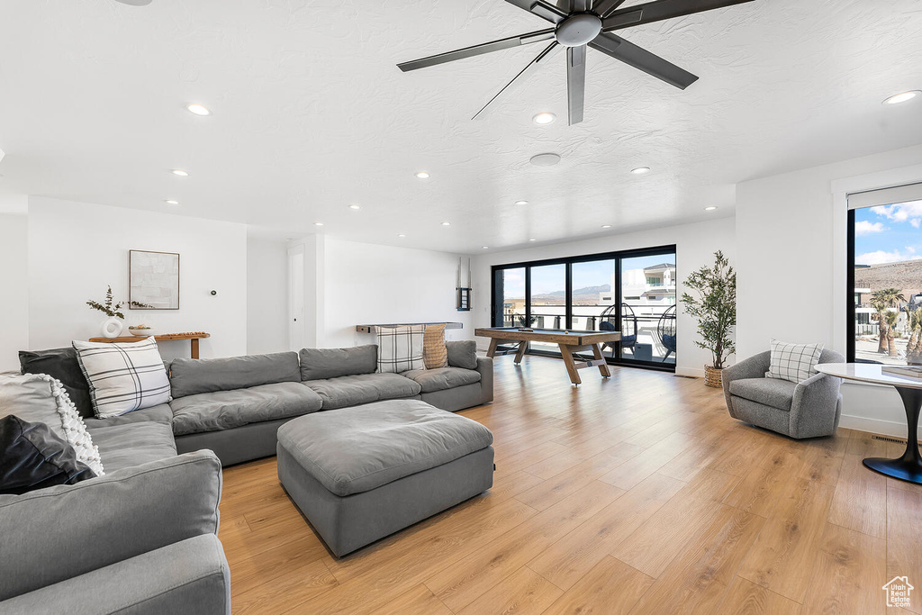 Living room featuring recessed lighting, ceiling fan, light wood-style floors, and billiards table