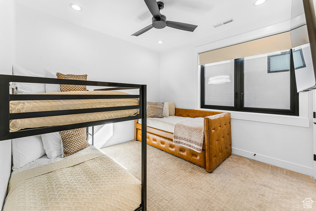 Bedroom with light carpet, recessed lighting, ceiling fan, and baseboards