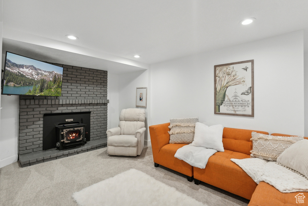 Carpeted living area featuring recessed lighting