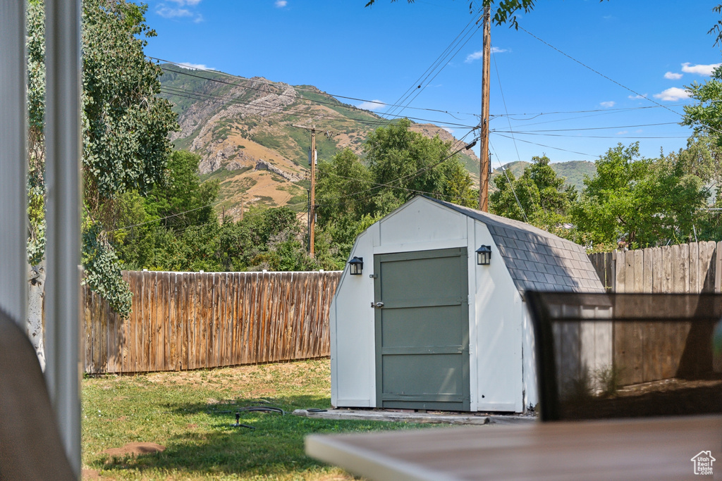 View of shed with a mountain view