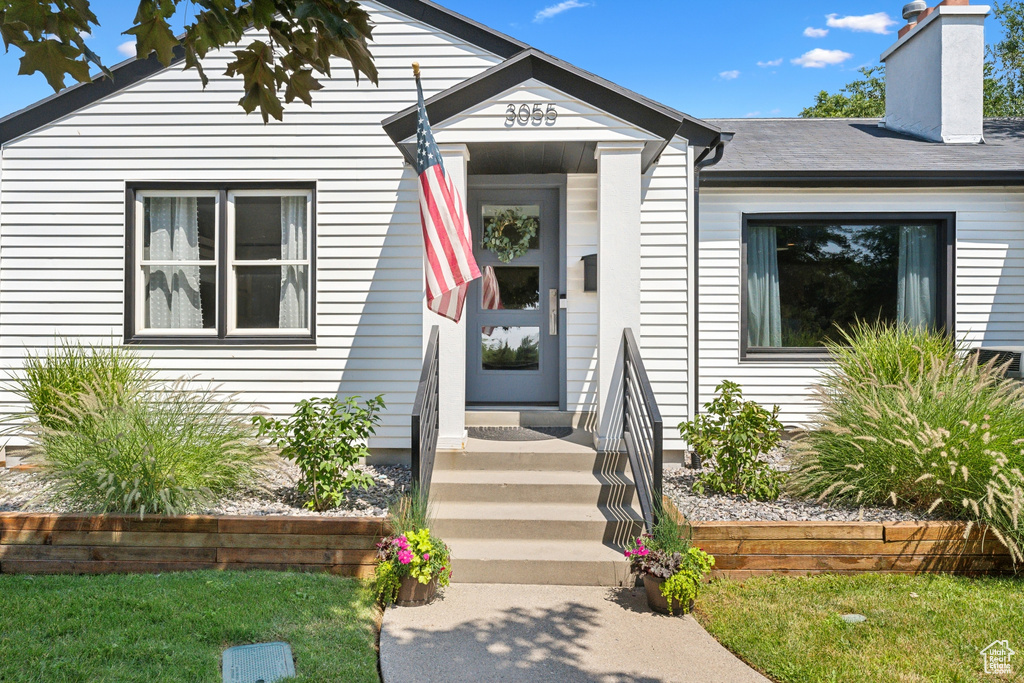 Bungalow-style home featuring a chimney